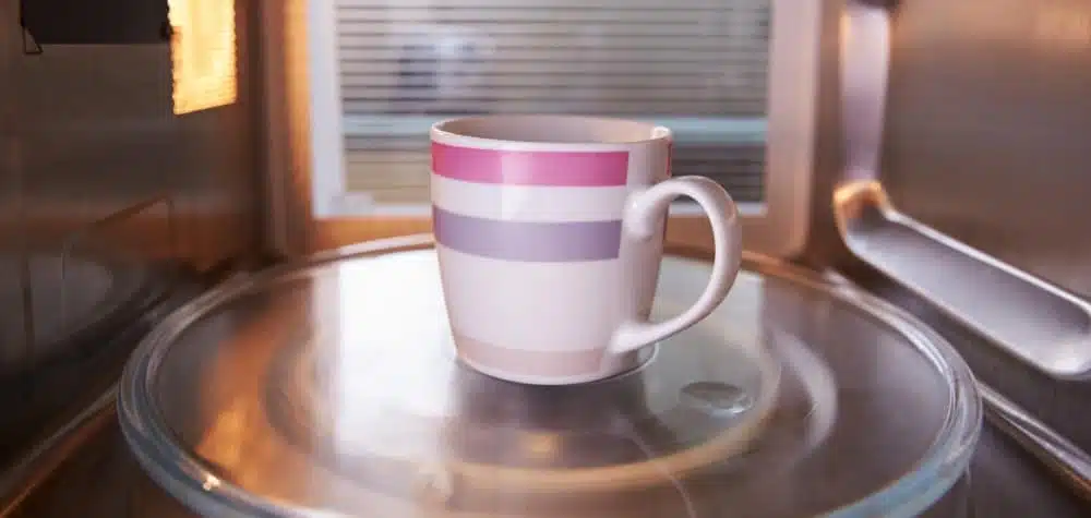 Mug of Coffee In A Microwave