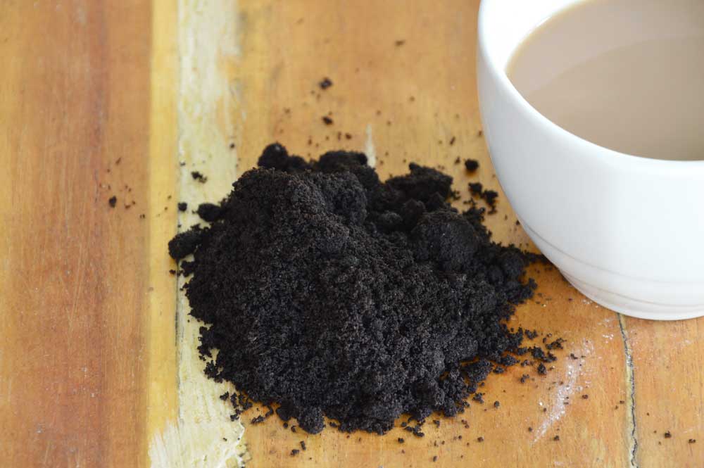 What are the consequences of putting coffee grounds