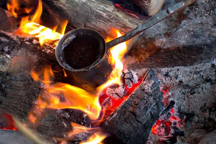  coffee being made on an open fire without a filter