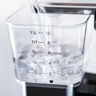 Filtered Water Being Poured into a Moccamaster