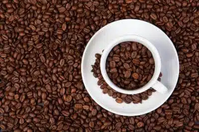 Some coffee beans in a coffee cup
