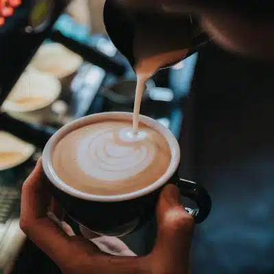 A Barista making a latte