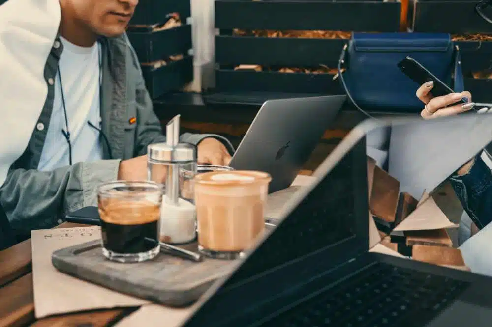 Some people working and enjoying coffee