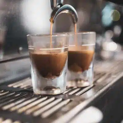 two shots of espresso being poured