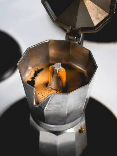 A Moka Pot Flowing with Freshly Brewed Coffee