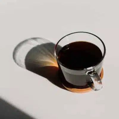 A cup of black coffee left sitting out