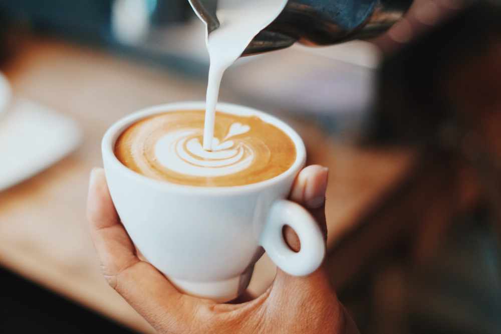 A Latte Being Poured