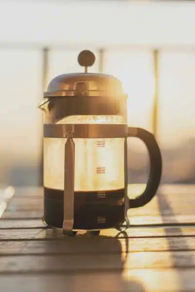 A Bodum Chambord French Press with the sun shining through it