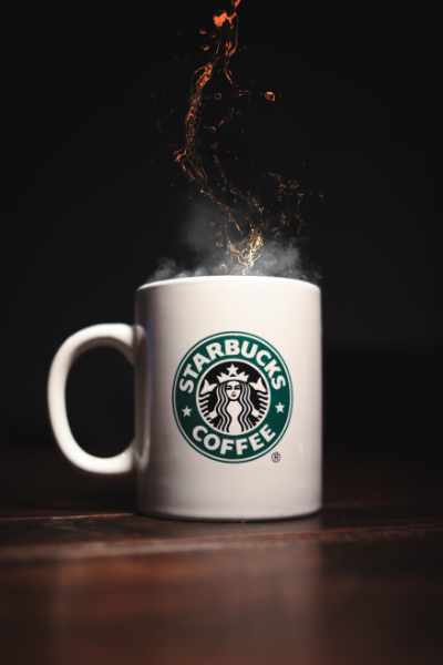 A Starbucks Cup with a big splash
