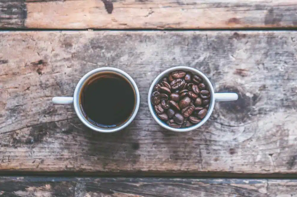 a cup of coffee and a cup of coffee beans