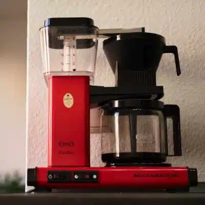 A Moccamaster drip coffee maker dripping some coffee