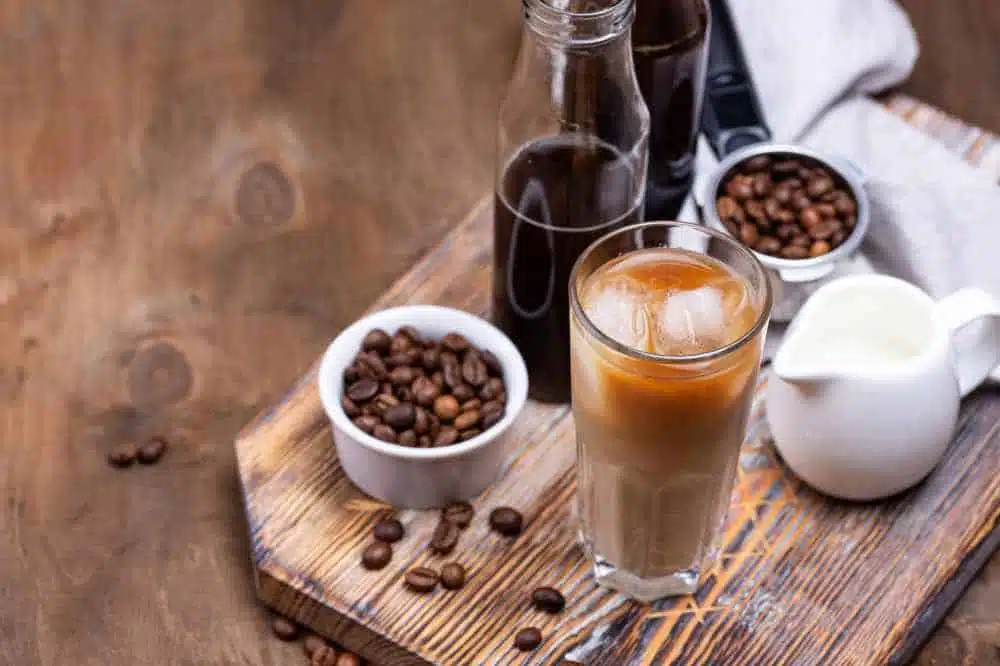 cold brew coffee with coffee beans and milk