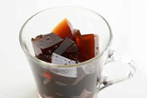 Some coffee jelly in a glass cup