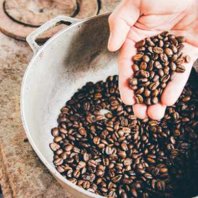roasting coffee beans in an iron skillet
