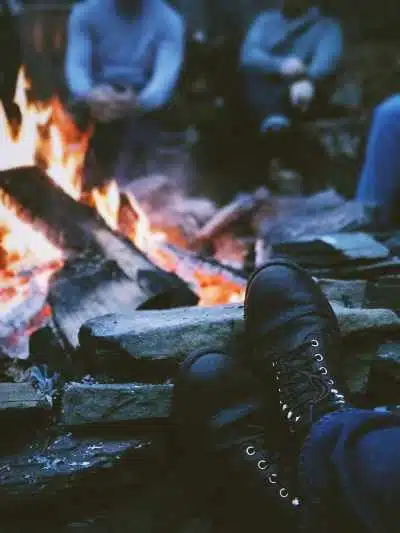 Feet up by a camp fire