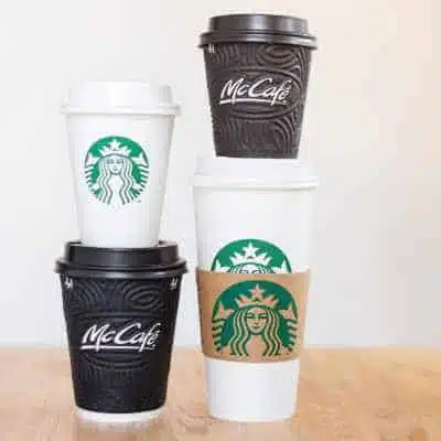mccafe cups beside starbucks cups