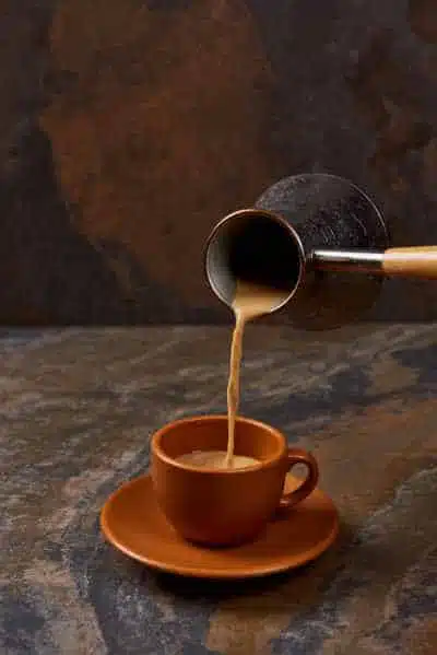 pouring out a cup of turkish coffee