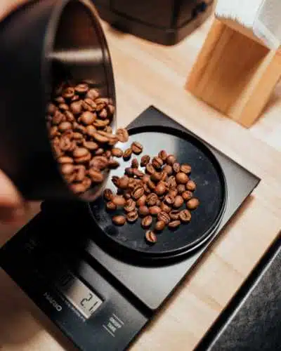 pouring some coffee beans out on to scales