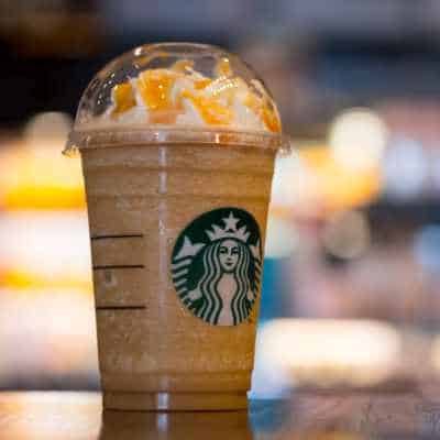 A close up of a Starbucks Caramel Frappuccino