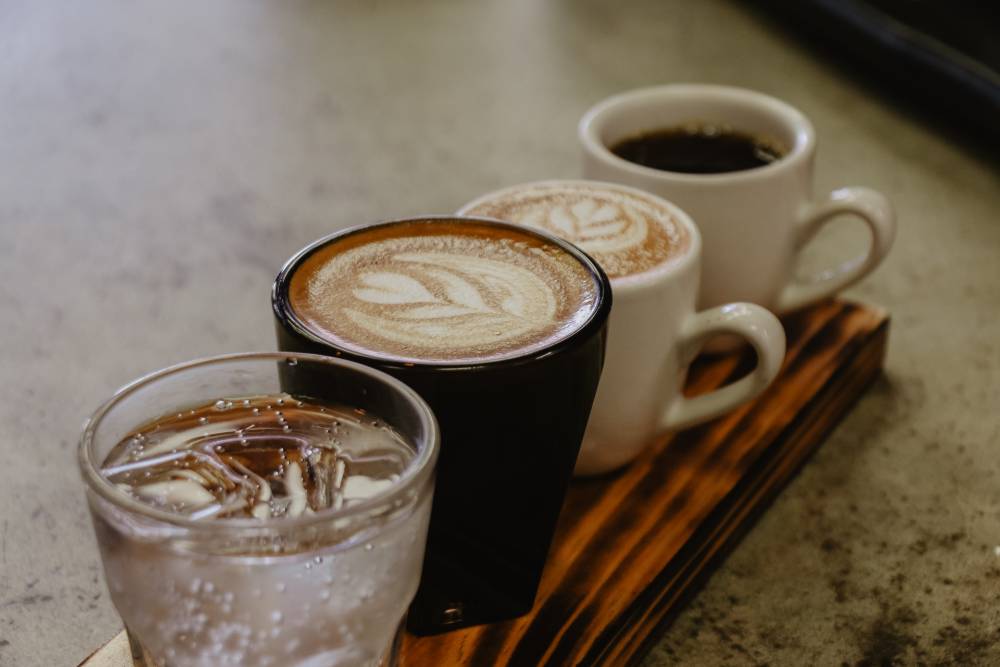 Specialty coffee drinks with a glass of water