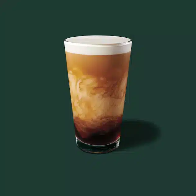 delightful image of a starbucks cold brew sweet cream in a pint glass